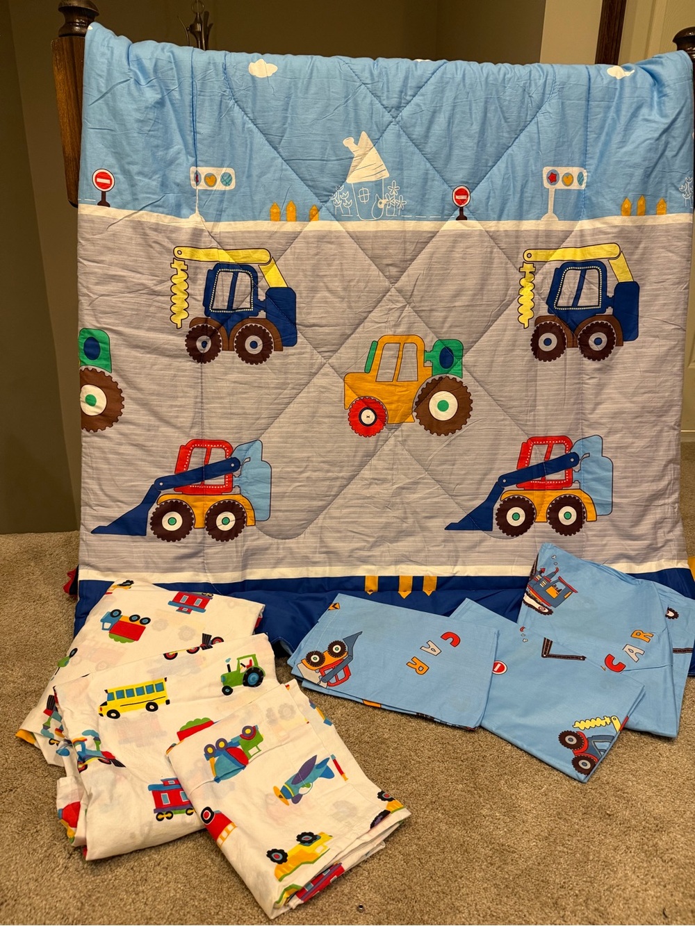 Toddler comforter and 2 sets of sheets.